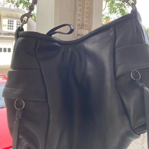 Beautiful Rough & Tumble small black Pillow style custom lined bag.